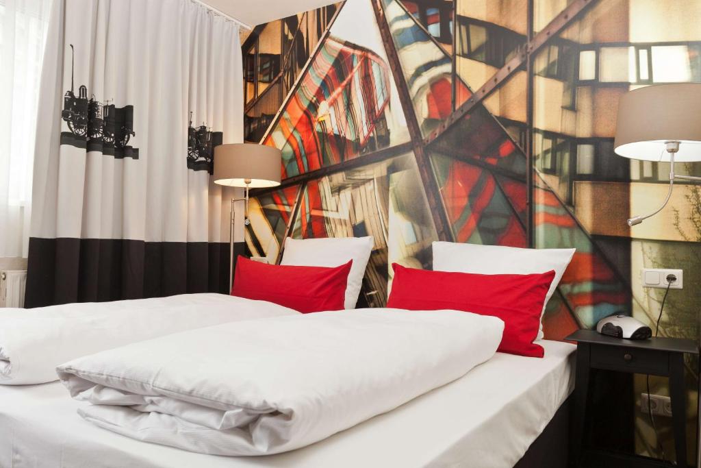 Postel nebo postele na pokoji v ubytování Best Western Hotel Nürnberg am Hauptbahnhof