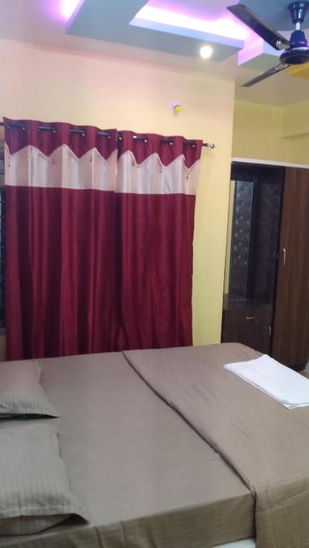 Ένα ή περισσότερα κρεβάτια σε δωμάτιο στο Banashree Guest inn