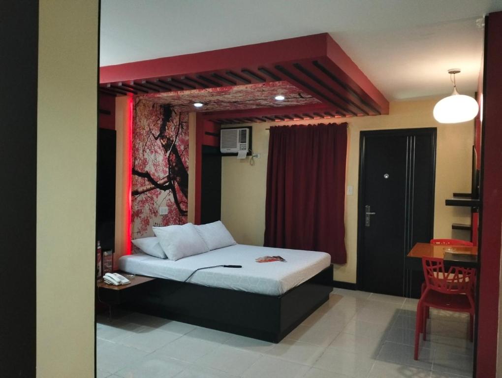 Postel nebo postele na pokoji v ubytování Hotel Sogo Quirino