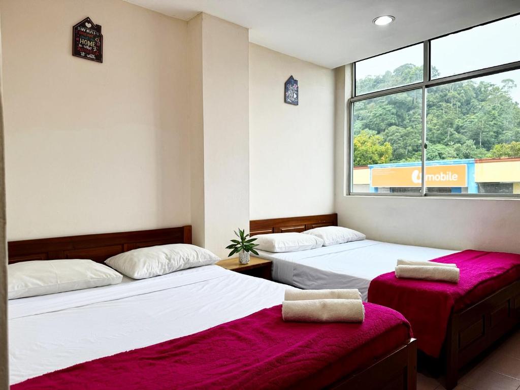 Postel nebo postele na pokoji v ubytování Town Inn Hotel - Rainforest
