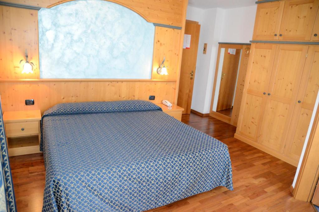 Postel nebo postele na pokoji v ubytování Hotel Corona