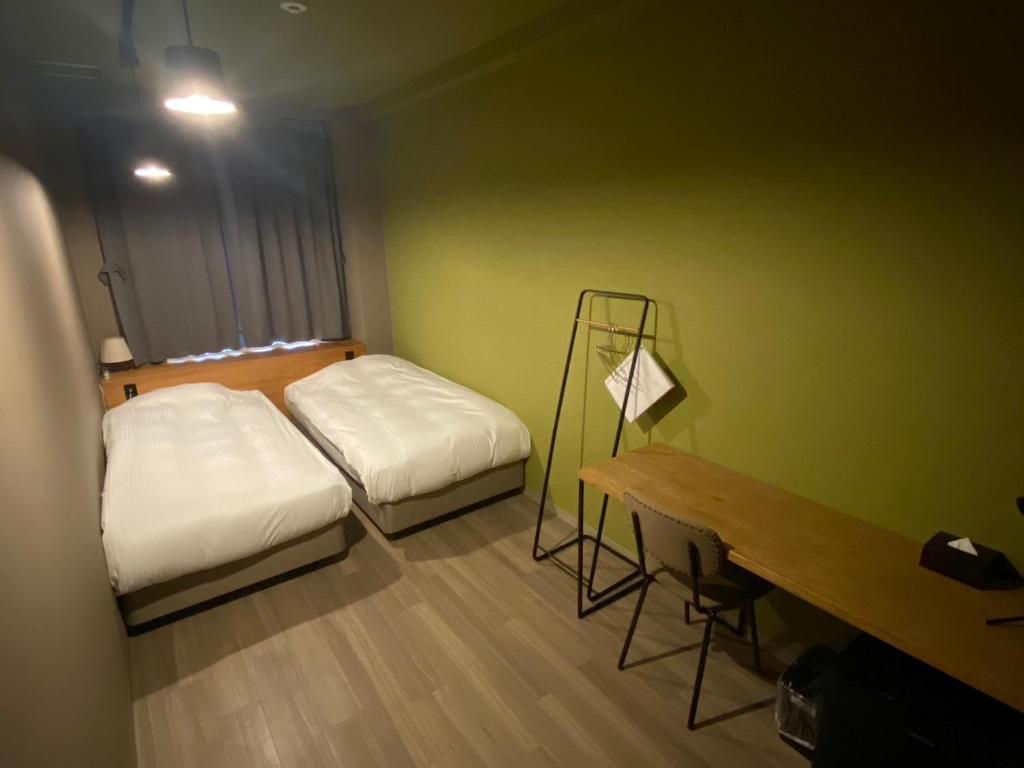 WISE OWL HOSTELS SAPPOROにあるベッド