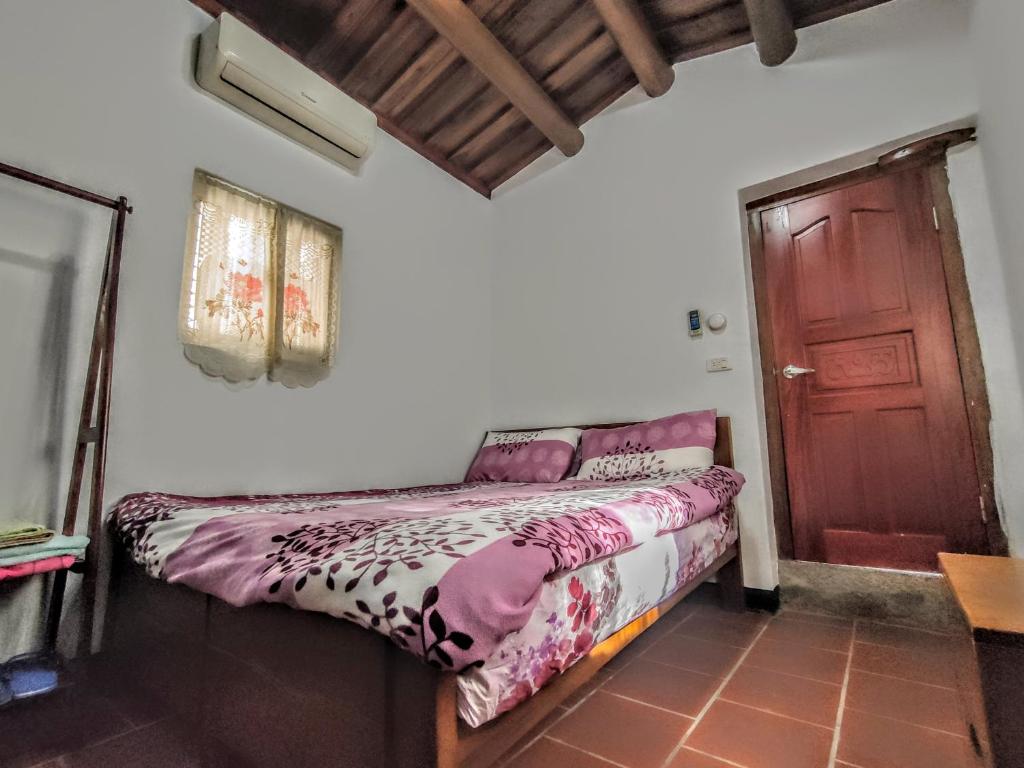 Postel nebo postele na pokoji v ubytování Lieyu B&B