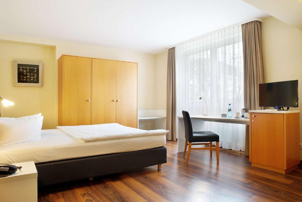 Postel nebo postele na pokoji v ubytování Best Western Macrander Hotel Dresden