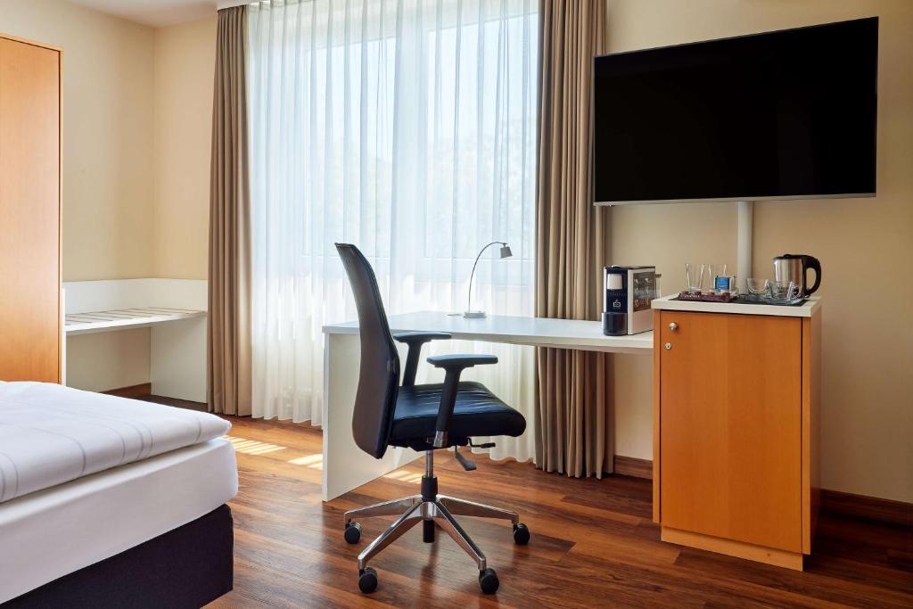 TV a/nebo společenská místnost v ubytování Best Western Macrander Hotel Dresden