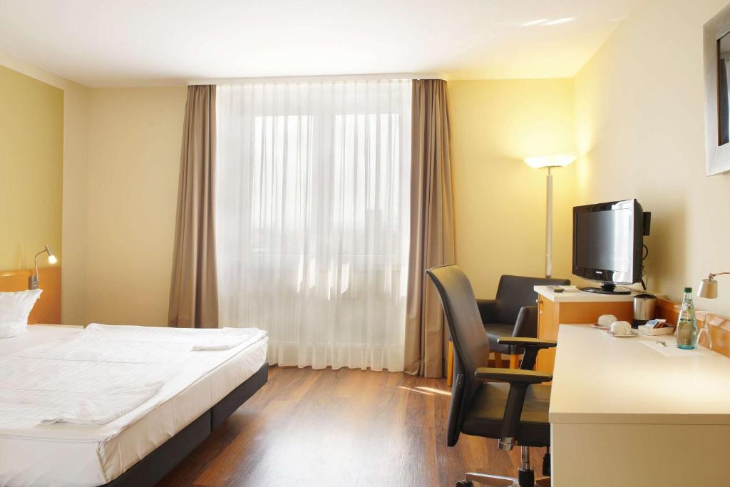 Postel nebo postele na pokoji v ubytování Best Western Macrander Hotel Dresden