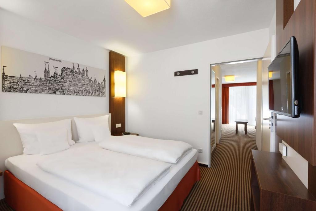 Postel nebo postele na pokoji v ubytování Best Western Hotel Nürnberg City West