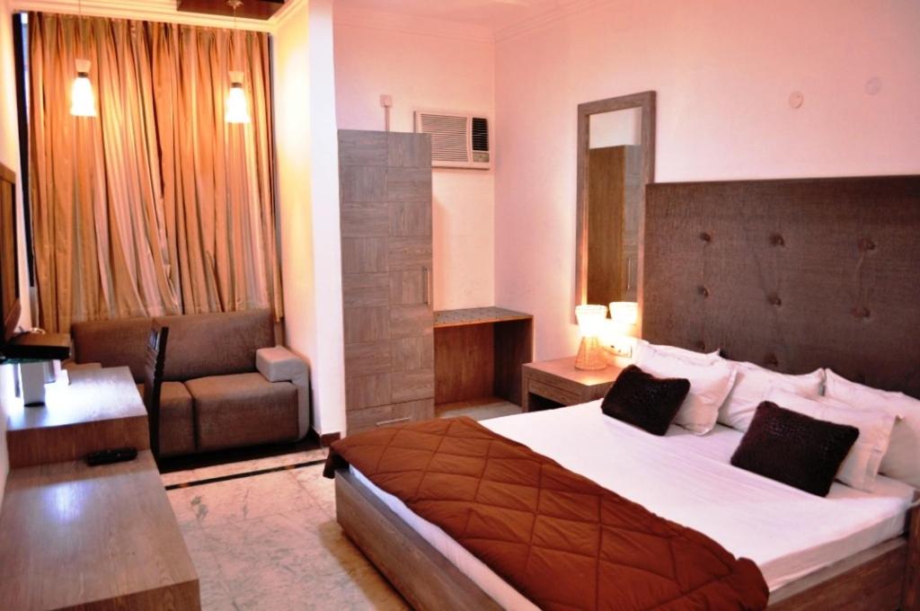 Postel nebo postele na pokoji v ubytování Solo Victoria Hotel