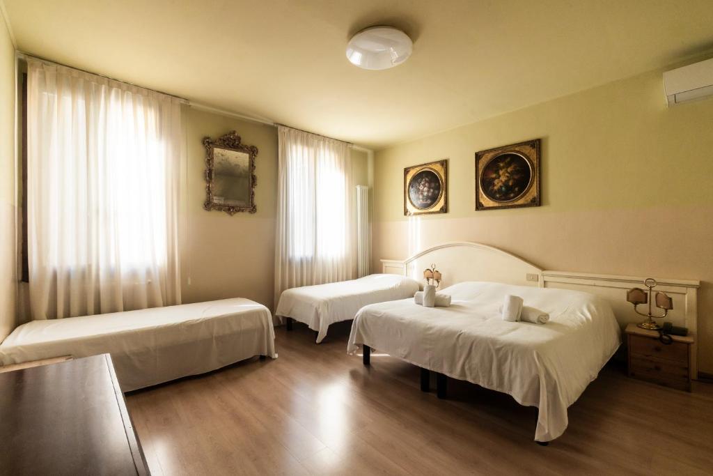 Postel nebo postele na pokoji v ubytování Hotel La Terrazza