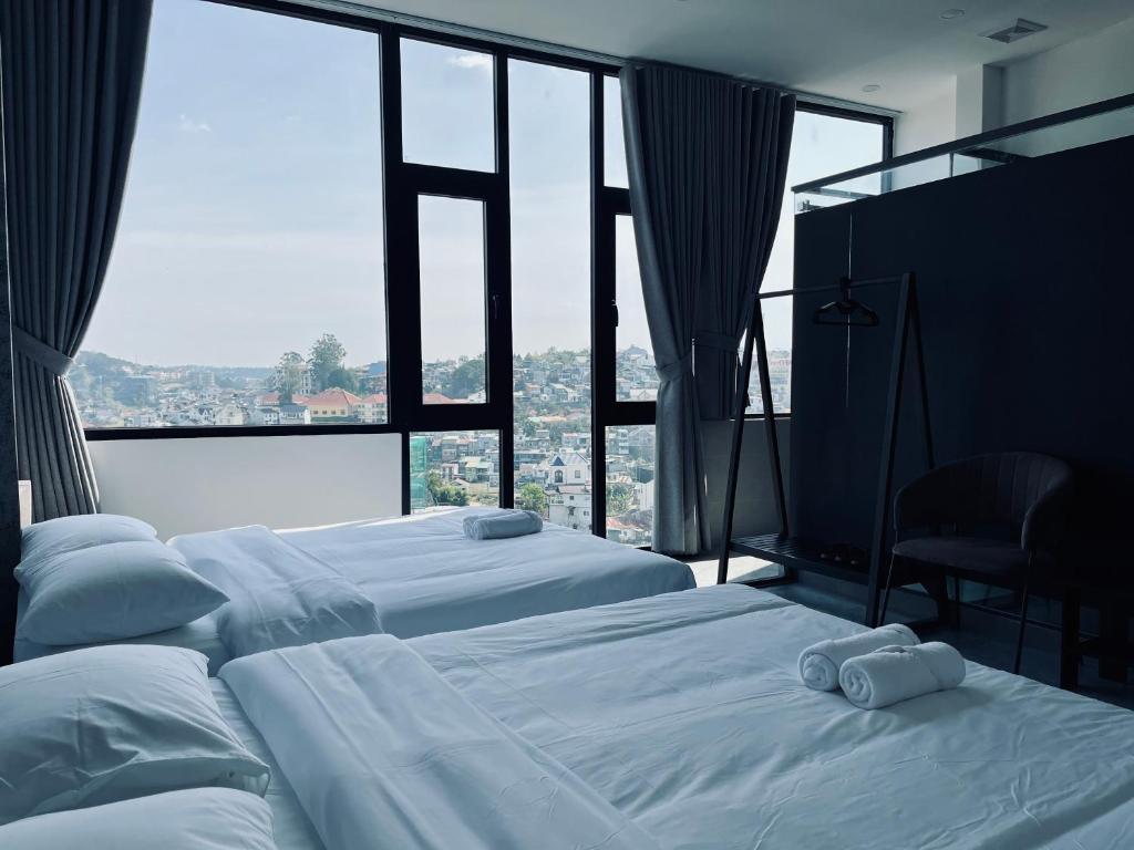 Postel nebo postele na pokoji v ubytování Ben Ben Hotel