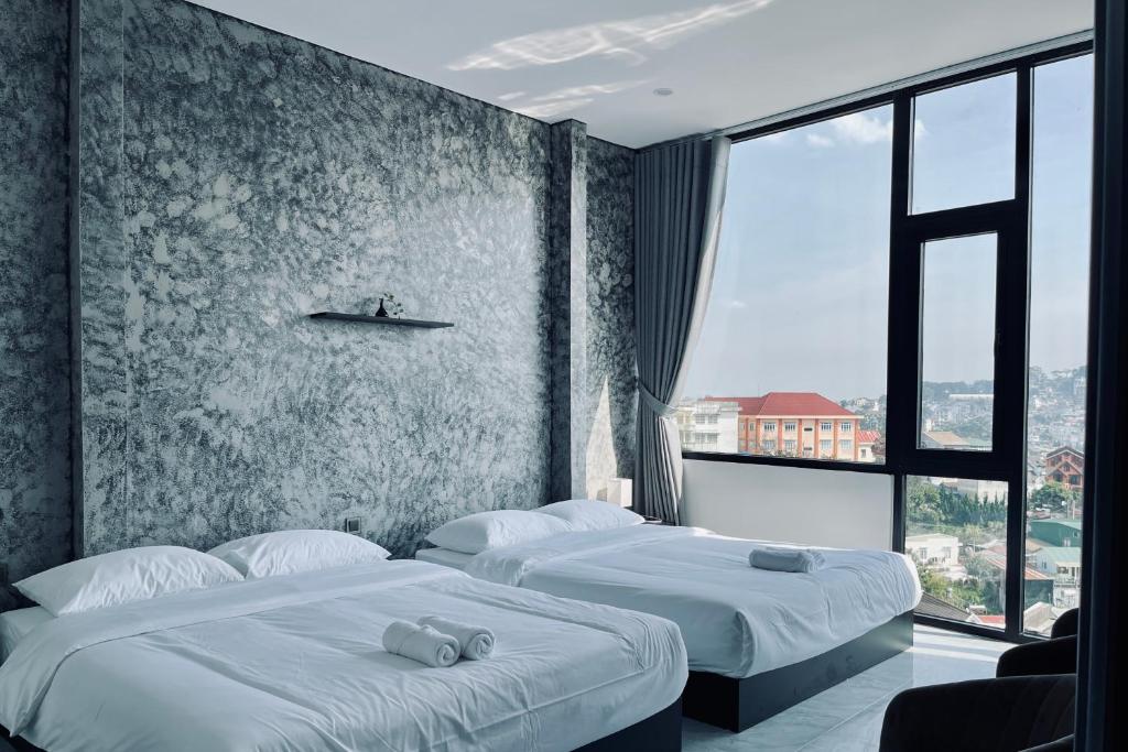 Postel nebo postele na pokoji v ubytování Ben Ben Hotel