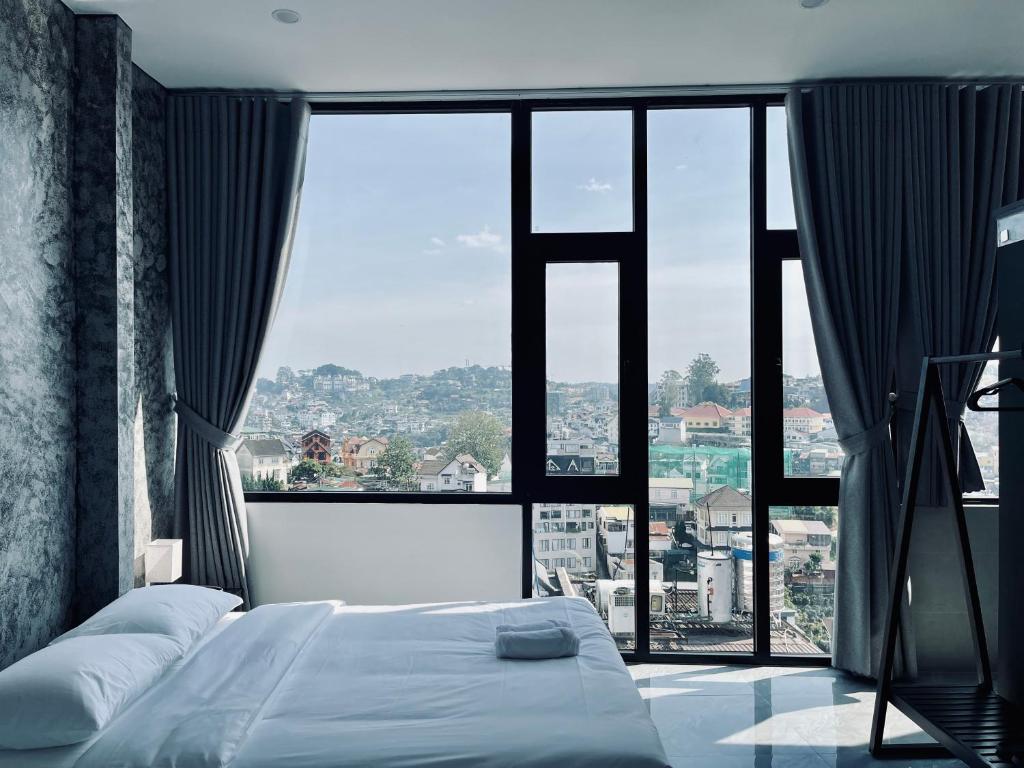 Postel nebo postele na pokoji v ubytování Ben Ben Hotel