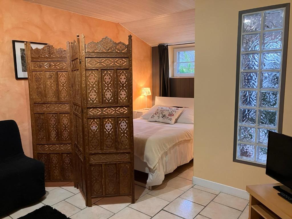 Postel nebo postele na pokoji v ubytování Le gîte de l'Araucaria