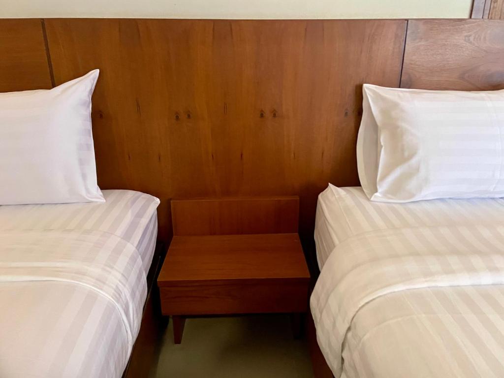 Postel nebo postele na pokoji v ubytování Kanlaya Place