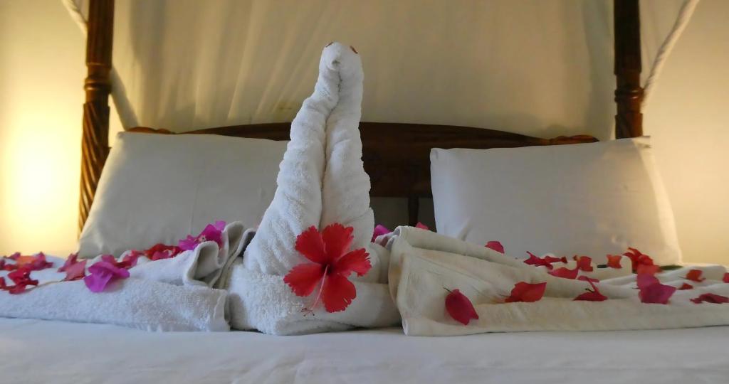 Postel nebo postele na pokoji v ubytování Lily Palm Resort