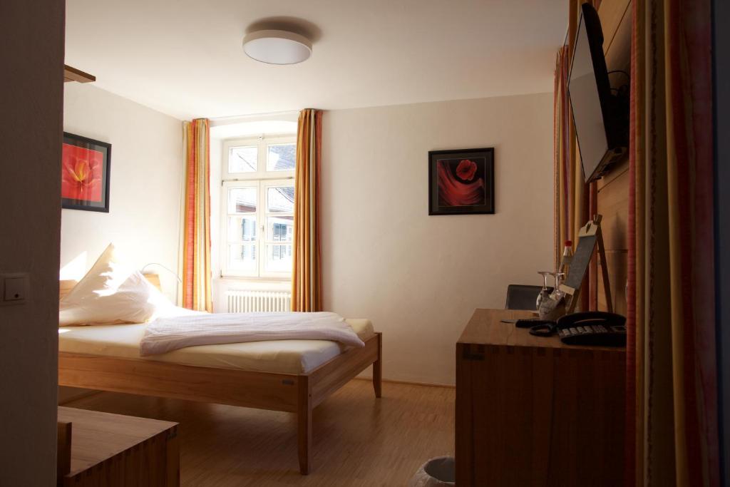Postel nebo postele na pokoji v ubytování Hotel & Café Ritter von Böhl