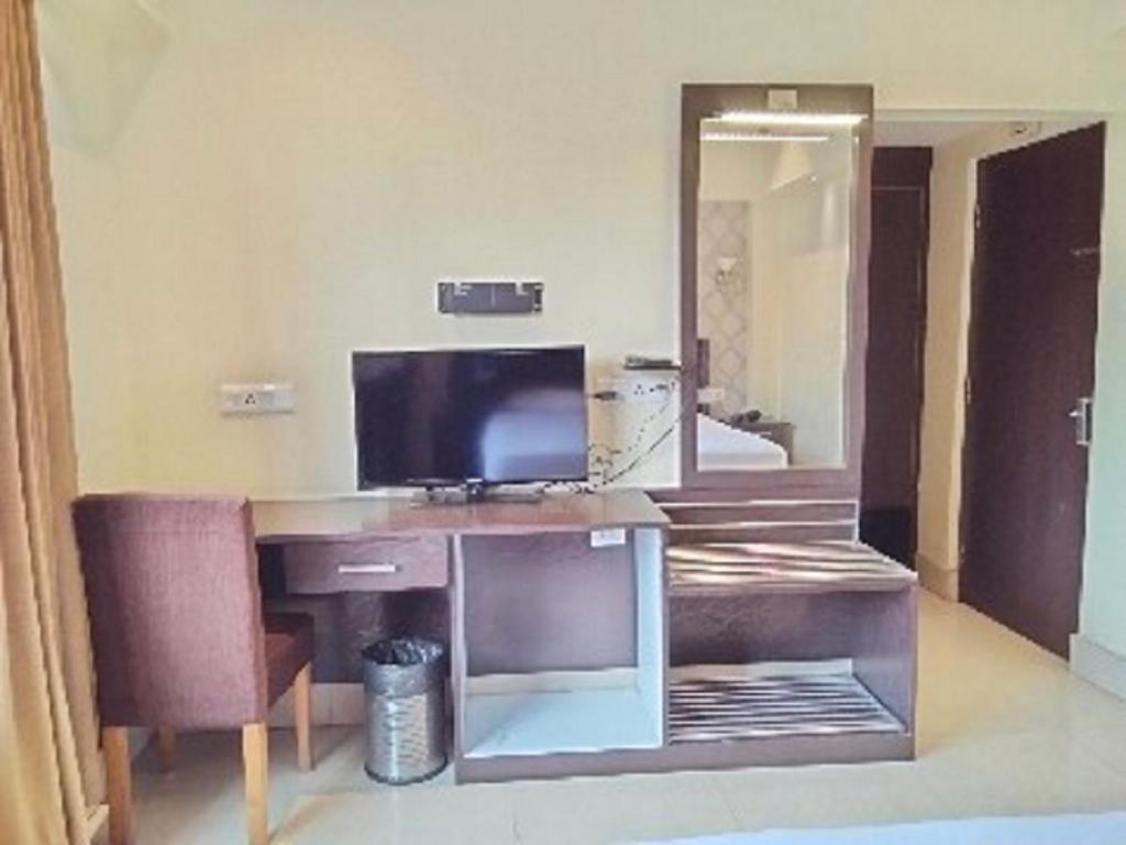 TV a/nebo společenská místnost v ubytování The Citi Residenci Hotel, Bidhannagar