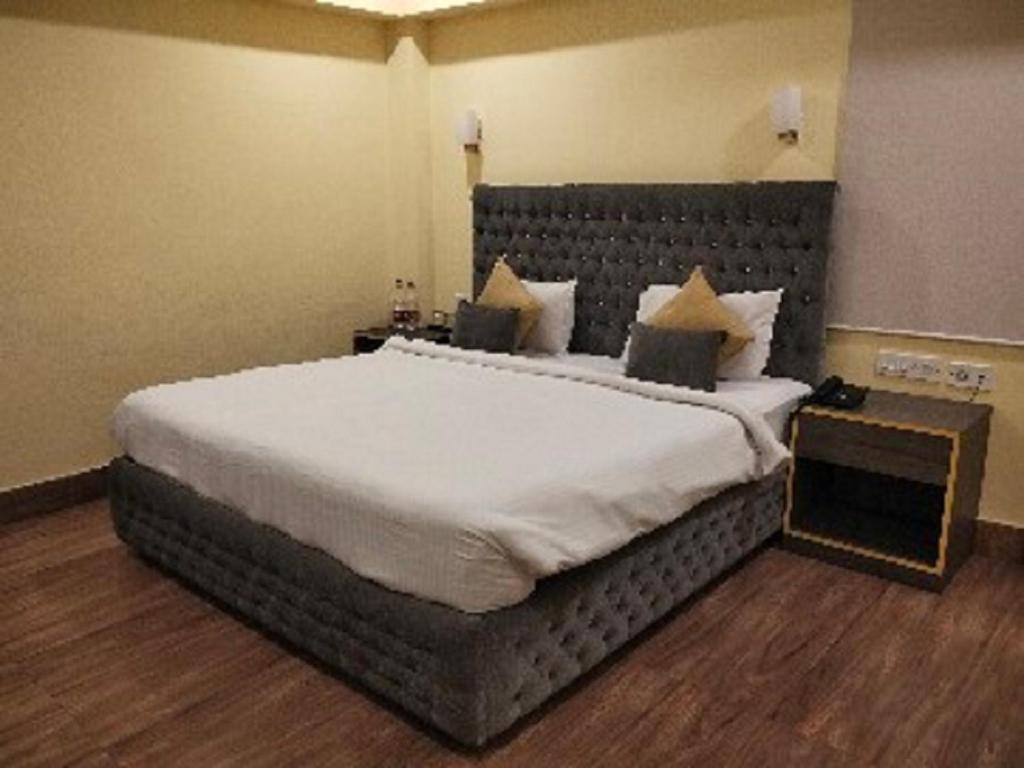 Postel nebo postele na pokoji v ubytování The Citi Residenci Hotel, Bidhannagar