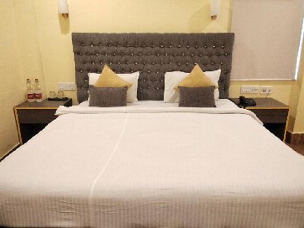 Postel nebo postele na pokoji v ubytování The Citi Residenci Hotel, Bidhannagar