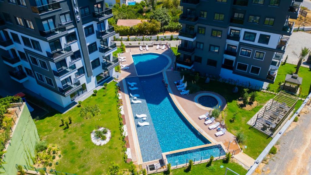 an aerial view of a swimming pool between two buildings at Seda Holiday in Alanya