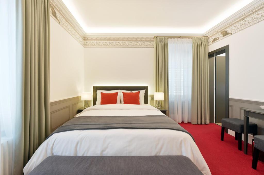 Postel nebo postele na pokoji v ubytování Golf Hotel René Capt