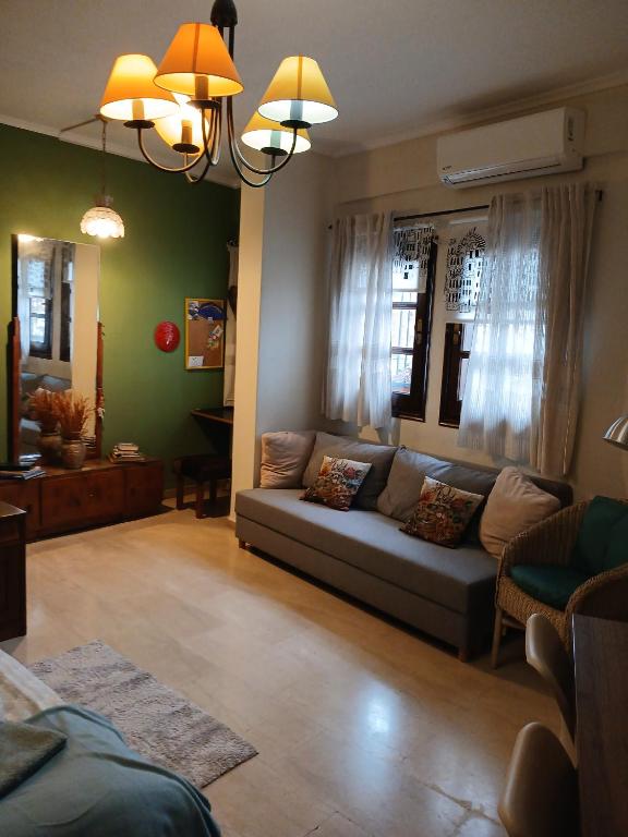 a living room with a couch and a table at Athina in Thessaloniki