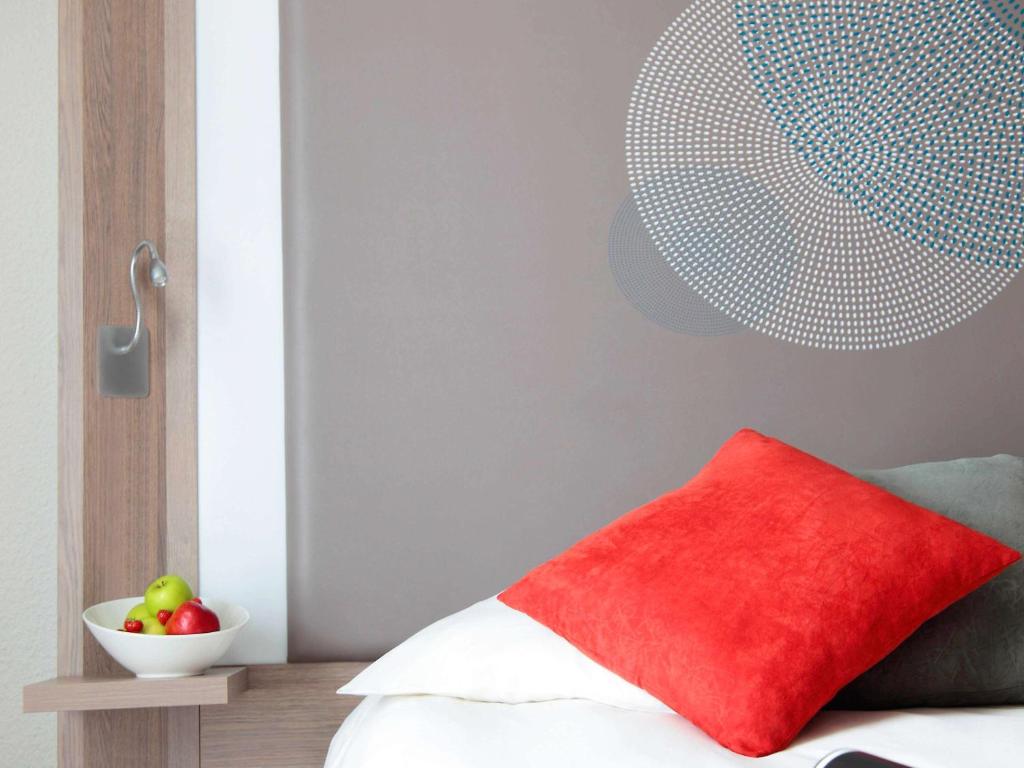 Postel nebo postele na pokoji v ubytování Novotel Narbonne Sud A9/A61