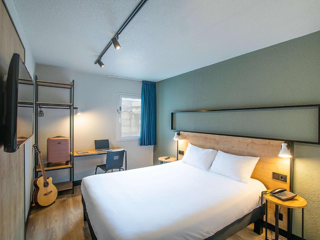 Postel nebo postele na pokoji v ubytování Hotel ibis Guimaraes
