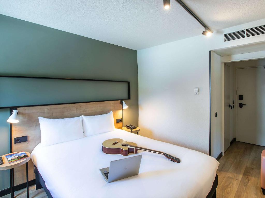 Postel nebo postele na pokoji v ubytování Hotel ibis Guimaraes