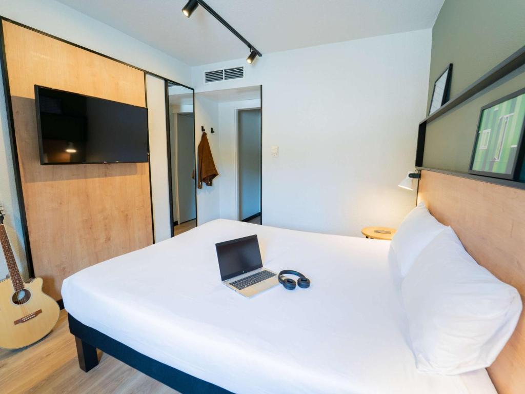 TV a/nebo společenská místnost v ubytování Hotel ibis Guimaraes