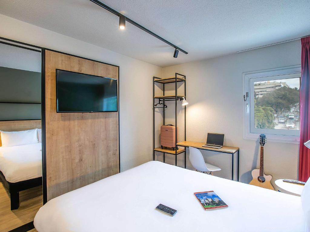 Postel nebo postele na pokoji v ubytování Hotel ibis Guimaraes