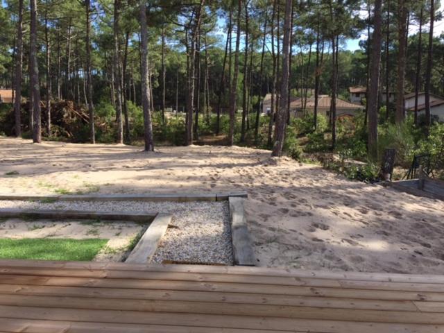 a sandbox in the sand with trees in the background at Villa MA&VA in Lacanau-Océan