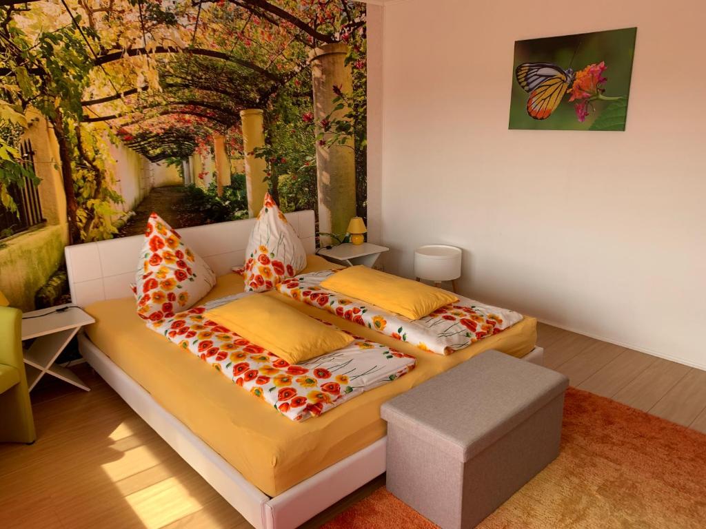 a living room with a couch with pillows at Ferienhaus am Geiersberg in Walkenried