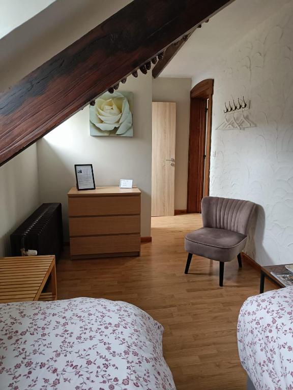 Postel nebo postele na pokoji v ubytování B&B Les Tchéous