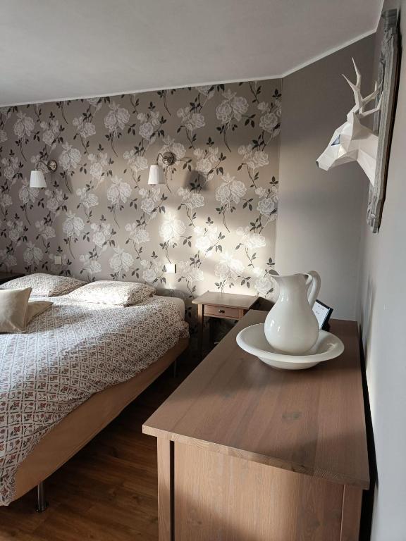 Postel nebo postele na pokoji v ubytování B&B Les Tchéous