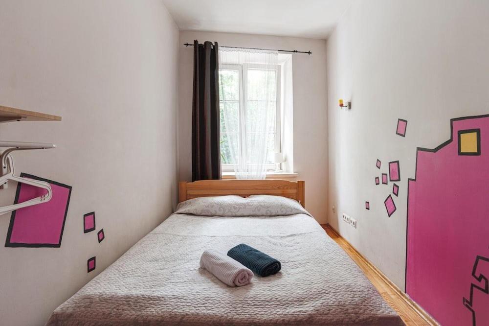 Postel nebo postele na pokoji v ubytování Pogo Hostel