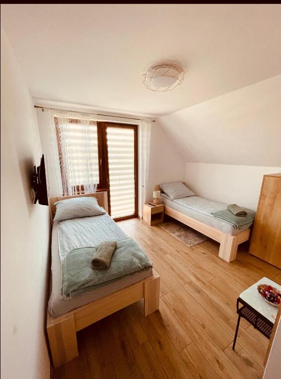 Posteľ alebo postele v izbe v ubytovaní Apartament Rybical - POKOJE