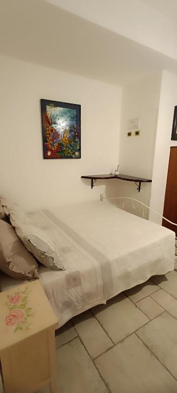 Postel nebo postele na pokoji v ubytování Mama Damì