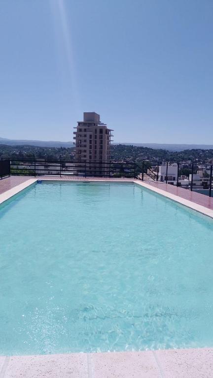 a large swimming pool on top of a building at Centro Carlos Paz Cibeles in Villa Carlos Paz