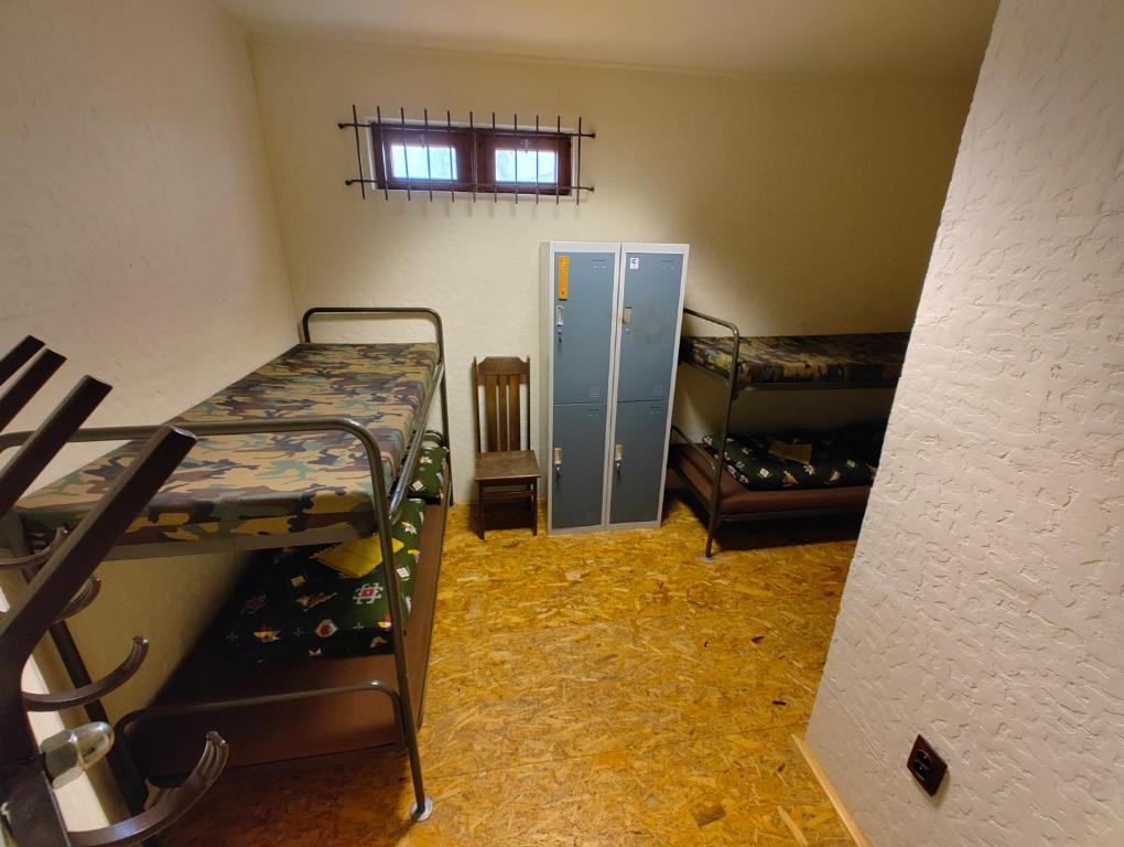 Postel nebo postele na pokoji v ubytování Areál SLZA