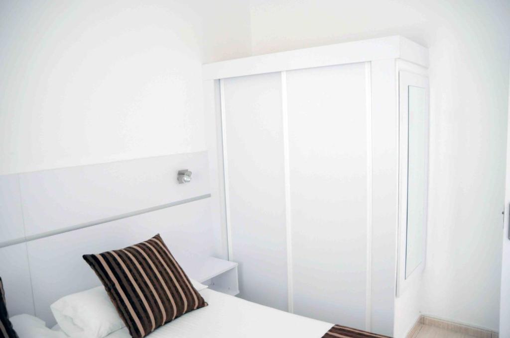 Postel nebo postele na pokoji v ubytování Bungalows Los Arcos