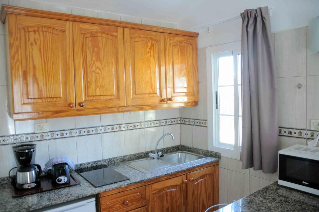 Kuchyň nebo kuchyňský kout v ubytování Bungalows Los Arcos