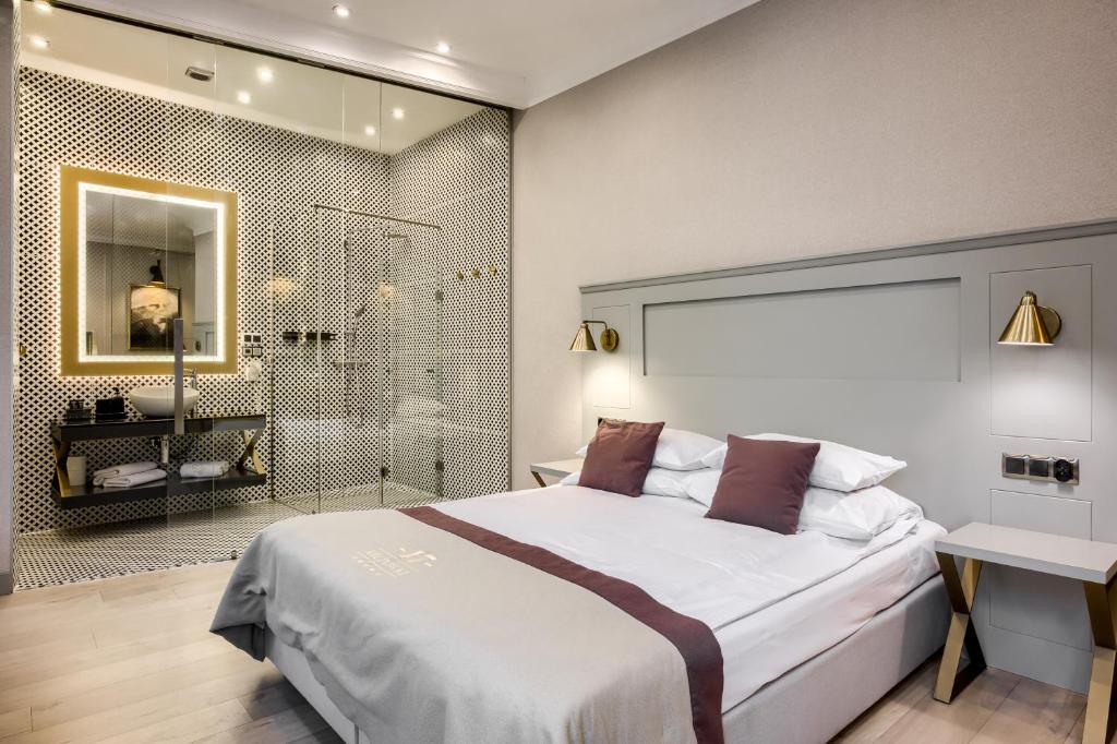 Posteľ alebo postele v izbe v ubytovaní Krupówki 17 Resort & SPA