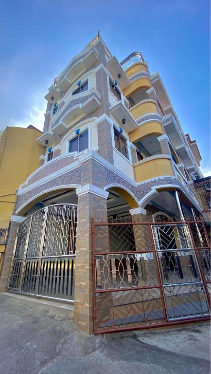a building with a gate in front of it at Princesa Sunset Homes in Puerto Princesa City