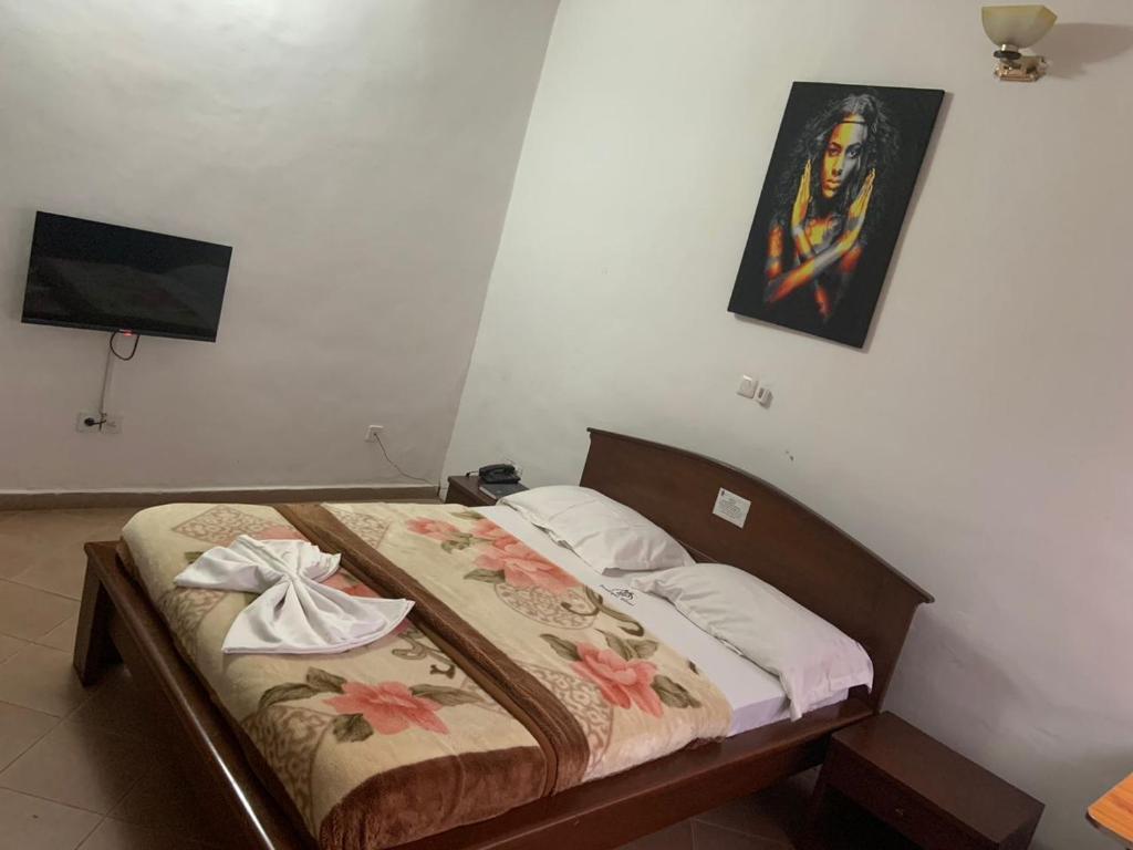 Postel nebo postele na pokoji v ubytování Prodiges Hôtel