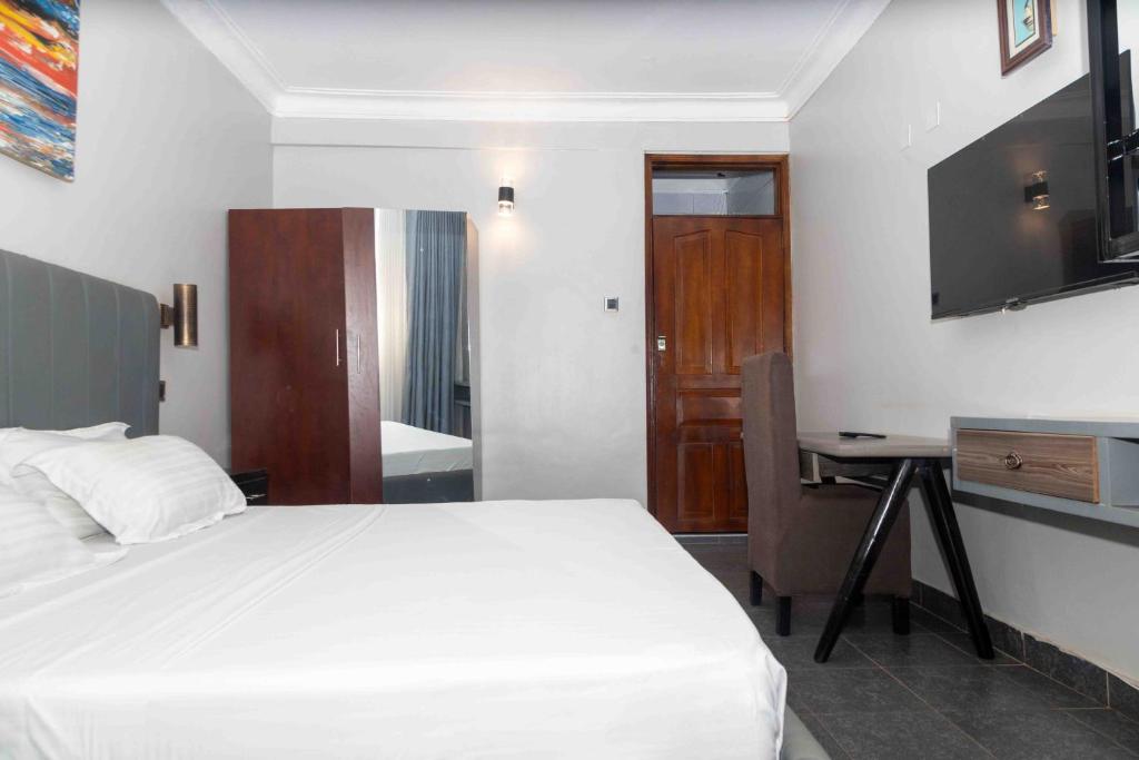 Postel nebo postele na pokoji v ubytování Mirembe Hotels - Source of the Nile Suites