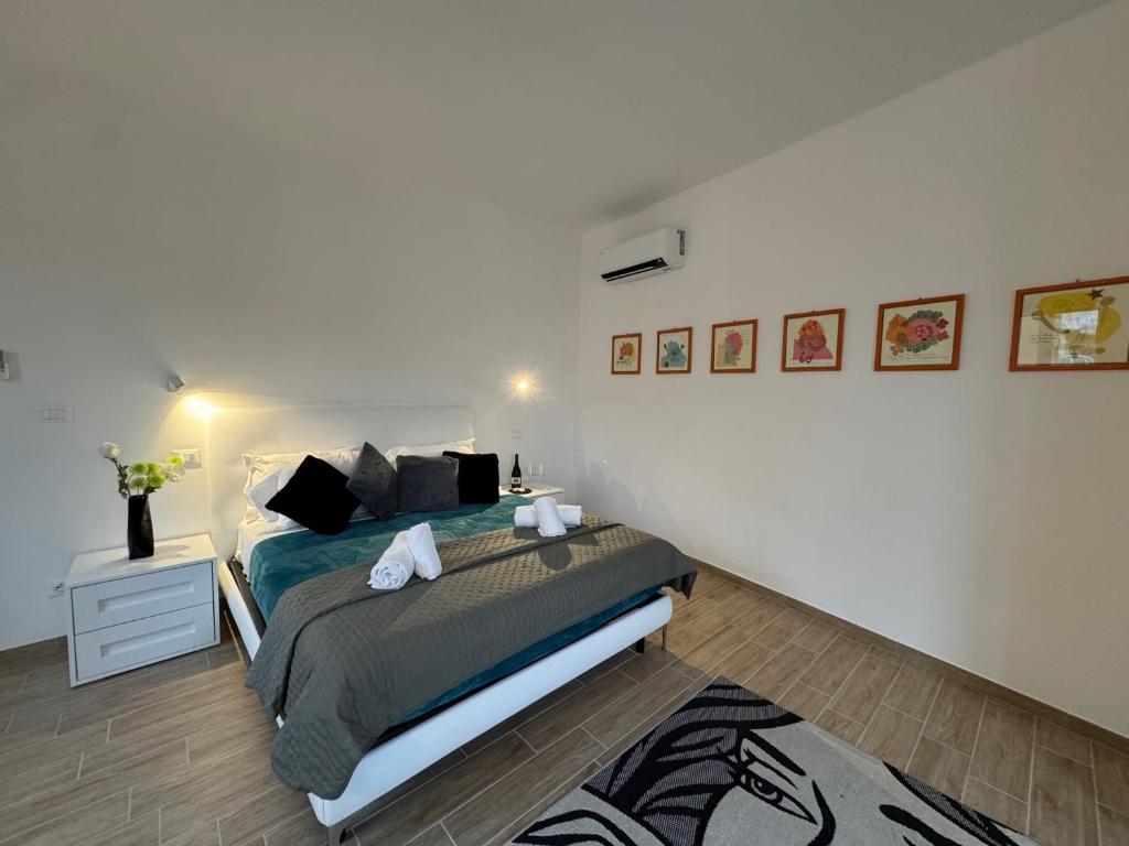 Postel nebo postele na pokoji v ubytování Albergo Tenco by Bottega