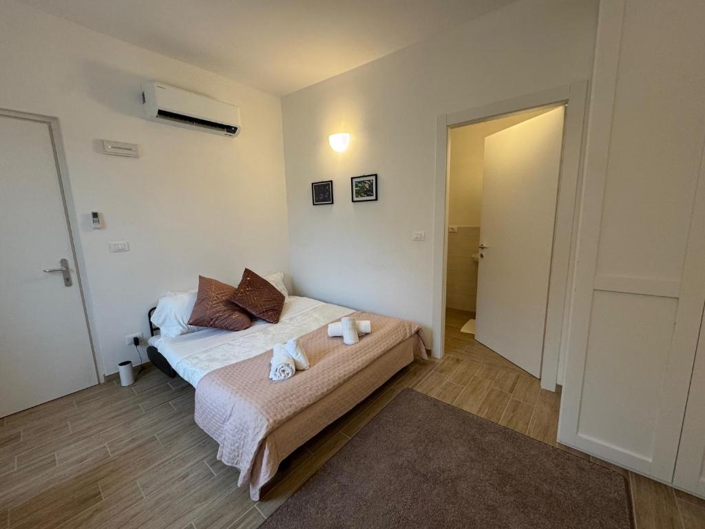 Postel nebo postele na pokoji v ubytování Albergo Tenco by Bottega