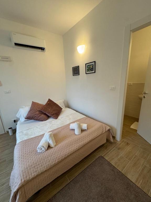 Postel nebo postele na pokoji v ubytování Albergo Tenco by Bottega