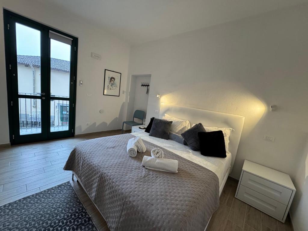 Postel nebo postele na pokoji v ubytování Albergo Tenco by Bottega